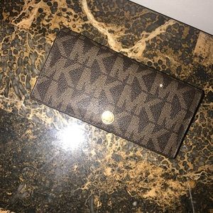 A Michael Kors wallet.
